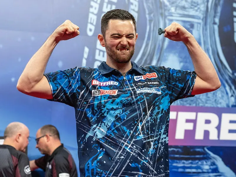 Luke Humphries celebrating a win on the PDC stage