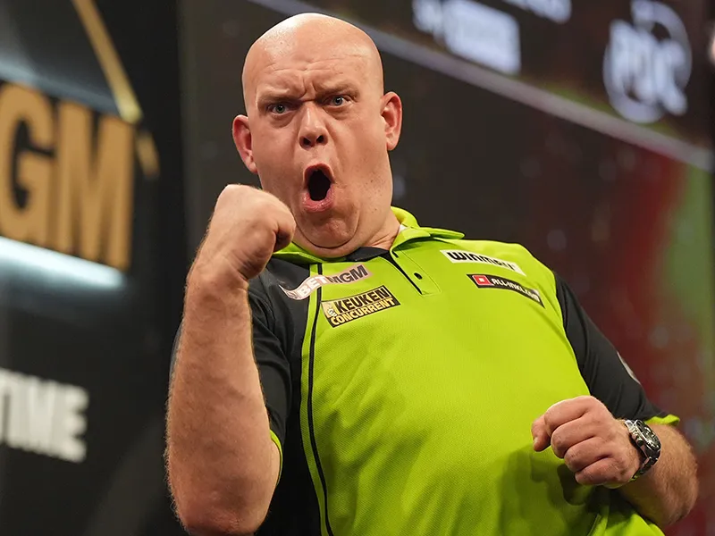 Michael van Gerwen throwing in his iconic green shirt on the PDC stage